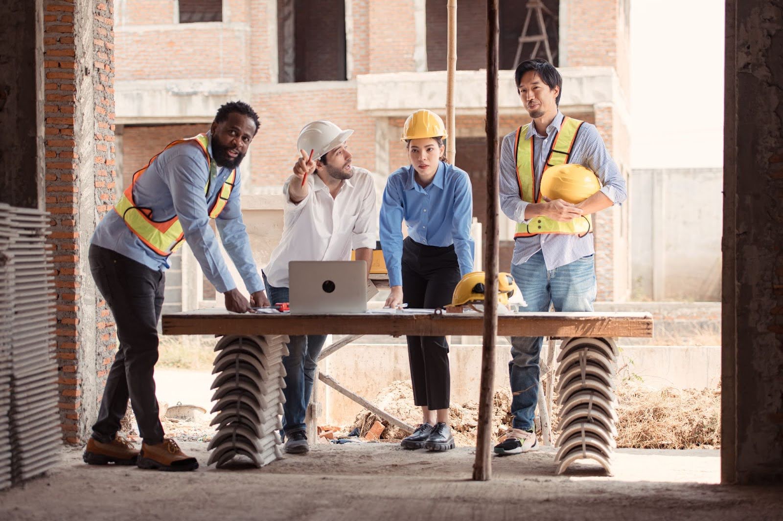 Licensed contractors and engineers assess residential home construction.