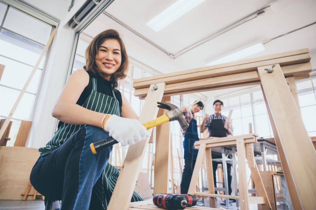 Team of carpenters collaborating on a home renovation project, measuring, cutting, and assembling materials with precision and teamwork.